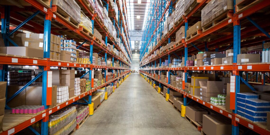 Boxes kept on row of shelves in the warehouse