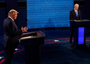 NASHVILLE, TENNESSEE - OCTOBER 22:  President Donald Trump answers a question as Democratic presidential candidate former Vice President Joe Biden listens during the second and final presidential debate at Belmont University on October 22, 2020 in Nashville, Tennessee. This is the last debate between the two candidates before the election on November 3. (Photo by Morry Gash-Pool/Getty Images)