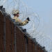 REFILE - CORRECTING THE TYPE OF THE WIRE U.S. Army soldiers install a razor wire fence along Anzalduas International Bridge near the U.S.- Mexico border in McAllen, Texas,  November 5, 2018. REUTERS/Delcia Lopez