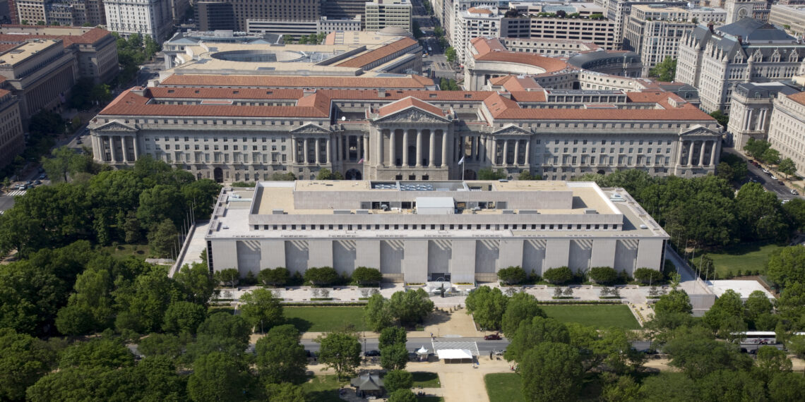 Aerial view of the Museum of Natural History and the Federal Triangle. The museum's collections total over 126 million specimens of plants, animals, fossils, minerals, rocks, meteorites, and human cultural artifacts. It is the second most popular of all of the Smithsonian museums and is also home to about 185 professional natural history scientists Ñ the largest group of scientists dedicated to the study of natural and cultural history in the world.