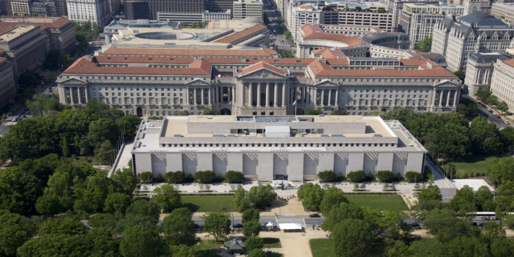 Aerial view of the Museum of Natural History and the Federal Triangle. The museum's collections total over 126 million specimens of plants, animals, fossils, minerals, rocks, meteorites, and human cultural artifacts. It is the second most popular of all of the Smithsonian museums and is also home to about 185 professional natural history scientists Ñ the largest group of scientists dedicated to the study of natural and cultural history in the world.