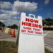 A "Now Hiring" sign advertising jobs at a hand car wash is seen along a street, as the spread of the coronavirus disease (COVID-19) continues, in Miami, Florida, U.S. May 8, 2020. REUTERS/Marco Bello