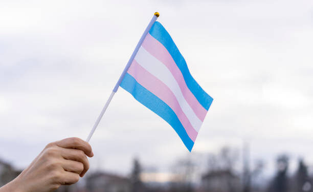Transgender Flag hold in the sky