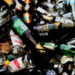 Sittingbourne, United Kingdom – November 16, 2021: A close-up top view of a pile of discarded alcoholic glass drink bottles