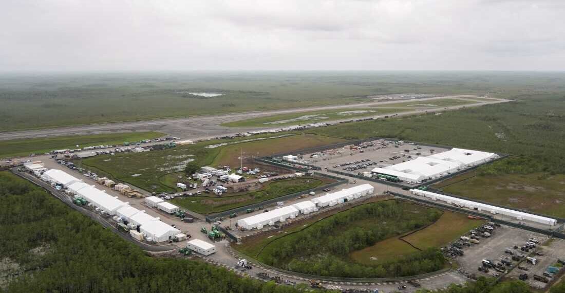 Work progresses on a new migrant detention facility dubbed "Alligator Alcatraz," at Dade-Collier Training and Transition facility in the Florida Everglades, Friday, July 4, 2025, in Ochopee, Fla. (AP Photo/Rebecca Blackwell)