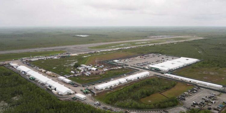 Work progresses on a new migrant detention facility dubbed "Alligator Alcatraz," at Dade-Collier Training and Transition facility in the Florida Everglades, Friday, July 4, 2025, in Ochopee, Fla. (AP Photo/Rebecca Blackwell)