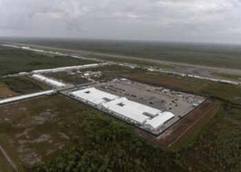 OCHOPEE, FLORIDA - JULY 4: In an aerial view from a helicopter, the migrant detention center, dubbed "Alligator Alcatraz," is seen located at the site of the Dade-Collier Training and Transition Airport on July 4, 2025 in Ochopee, Florida. U.S. President Donald Trump was present at the opening of the 5,000-bed facility, located at an abandoned airfield in the Everglades wetlands, as part of his expansion of undocumented migrant deportations. (Photo by Alon Skuy/Getty Images)