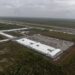OCHOPEE, FLORIDA - JULY 4: In an aerial view from a helicopter, the migrant detention center, dubbed "Alligator Alcatraz," is seen located at the site of the Dade-Collier Training and Transition Airport on July 4, 2025 in Ochopee, Florida. U.S. President Donald Trump was present at the opening of the 5,000-bed facility, located at an abandoned airfield in the Everglades wetlands, as part of his expansion of undocumented migrant deportations. (Photo by Alon Skuy/Getty Images)