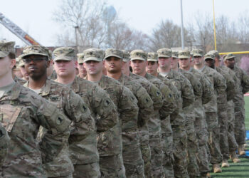 Soldiers of the 198th Expeditionary Signal Battalion stand in formation at  Alumni Stadium at Delaware State University for their homecoming ceremony after a yearlong deployment in support of Operation Enduring Freedom, April 13, 2014, Dover, Del. (Photo by Staff Sgt. James Pernol, National Guard, Released)