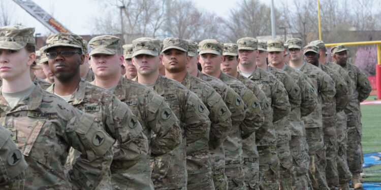 Soldiers of the 198th Expeditionary Signal Battalion stand in formation at  Alumni Stadium at Delaware State University for their homecoming ceremony after a yearlong deployment in support of Operation Enduring Freedom, April 13, 2014, Dover, Del. (Photo by Staff Sgt. James Pernol, National Guard, Released)