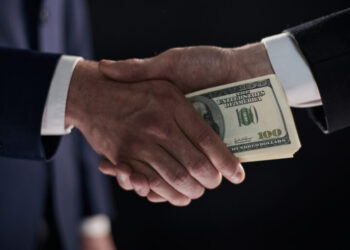 Close-up image of handshake between two colleagues.