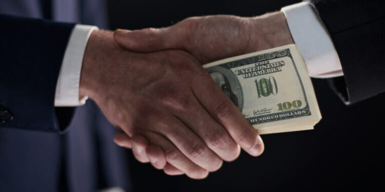 Close-up image of handshake between two colleagues.