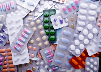 Colorful Assortment Of Medicine Tables & Capsules.