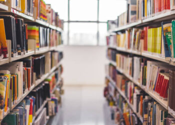 Front view from a book hall in a library. Through this image we can find things about education, study, school, science and much more.