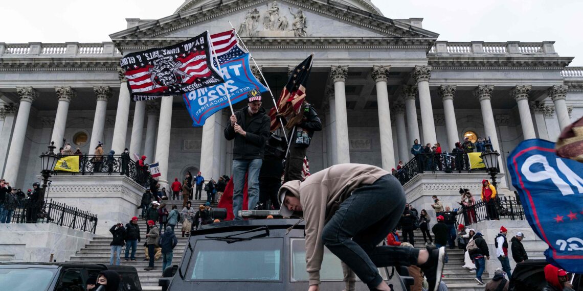 TOPSHOT - Supporters of US President Donald Trump protest outside the US Capitol on January 6, 2021, in Washington, DC. - Demonstrators breeched security and entered the Capitol as Congress debated the a 2020 presidential election Electoral Vote Certification. (Photo by ALEX EDELMAN / AFP)