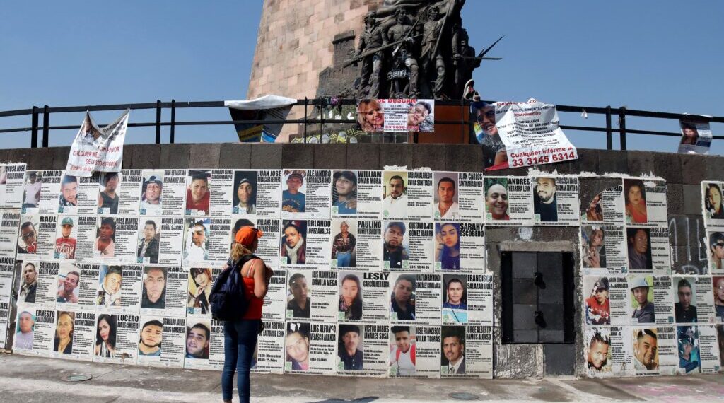 Araceli Hernandez, 50, a housewife who lives in San Pedro Tlaquepaque and is looking for two of her missing sons, looks at at the Glorieta de los Desaparecidos (Roundabout of the Disappeared), in Guadalajara, Jalisco state, Mexico, on May 1, 2022. - While most Mexicans will celebrate Mother's Day on May 10, 2022, thousands of women will take to the streets or will continue searching for their disappeared children. (Photo by ULISES RUIZ / AFP)
