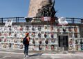 Araceli Hernandez, 50, a housewife who lives in San Pedro Tlaquepaque and is looking for two of her missing sons, looks at at the Glorieta de los Desaparecidos (Roundabout of the Disappeared), in Guadalajara, Jalisco state, Mexico, on May 1, 2022. - While most Mexicans will celebrate Mother's Day on May 10, 2022, thousands of women will take to the streets or will continue searching for their disappeared children. (Photo by ULISES RUIZ / AFP)