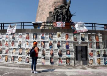 Araceli Hernandez, 50, a housewife who lives in San Pedro Tlaquepaque and is looking for two of her missing sons, looks at at the Glorieta de los Desaparecidos (Roundabout of the Disappeared), in Guadalajara, Jalisco state, Mexico, on May 1, 2022. - While most Mexicans will celebrate Mother's Day on May 10, 2022, thousands of women will take to the streets or will continue searching for their disappeared children. (Photo by ULISES RUIZ / AFP)