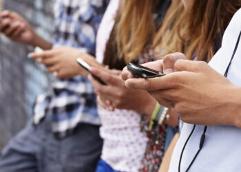 Teenagers using cellphones