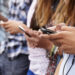Teenagers using cellphones
