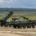 Soviet MLRS Smertch (9A52-2) in background and transporter-loader 9T234-2 with 12 rockets demonstrated at ARMY'2016 International military technical forum, Alabino range, Russia
